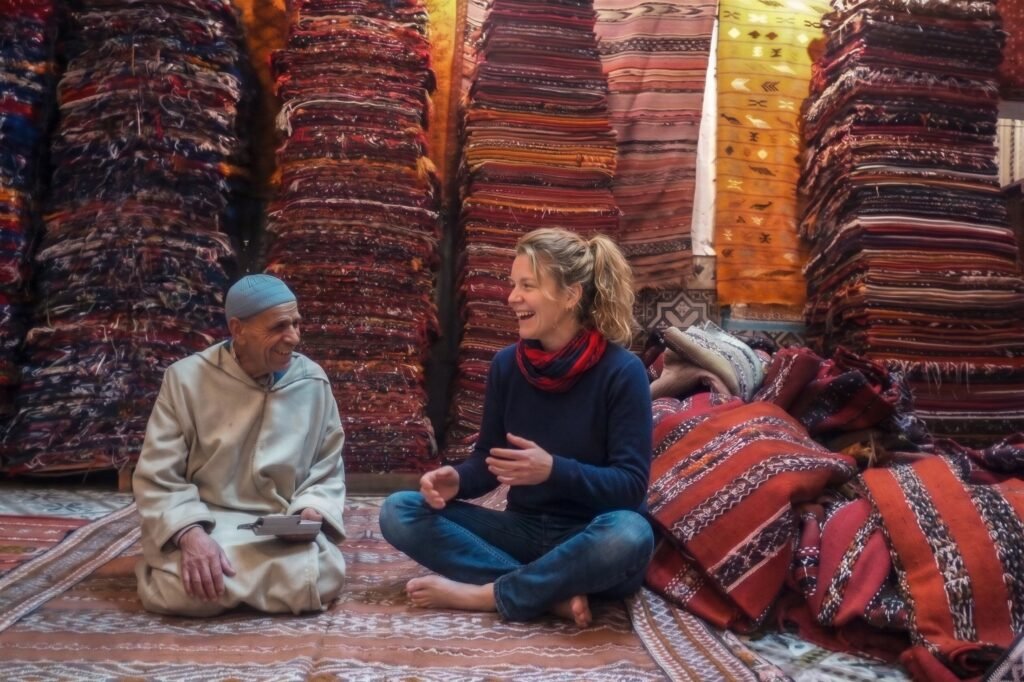 Checking an authentic Moroccan rug in a rug shop